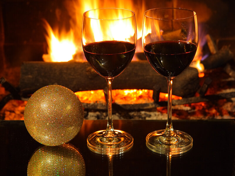Two Wine Glasses by Fire