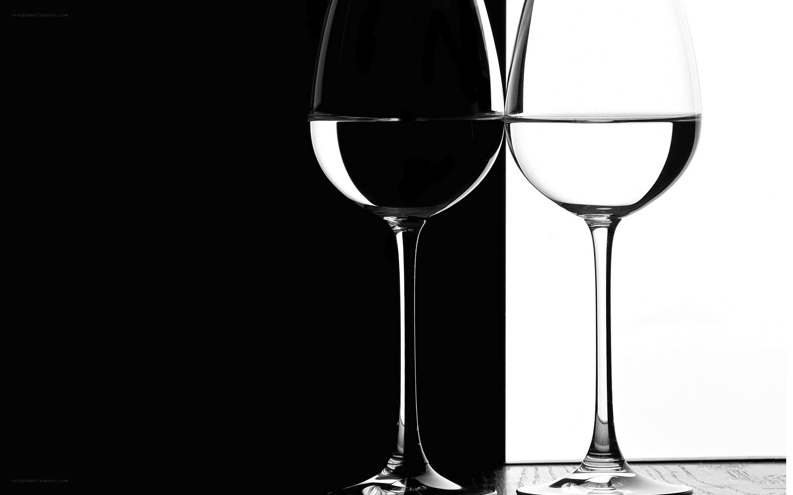 Two wine glasses in contrast