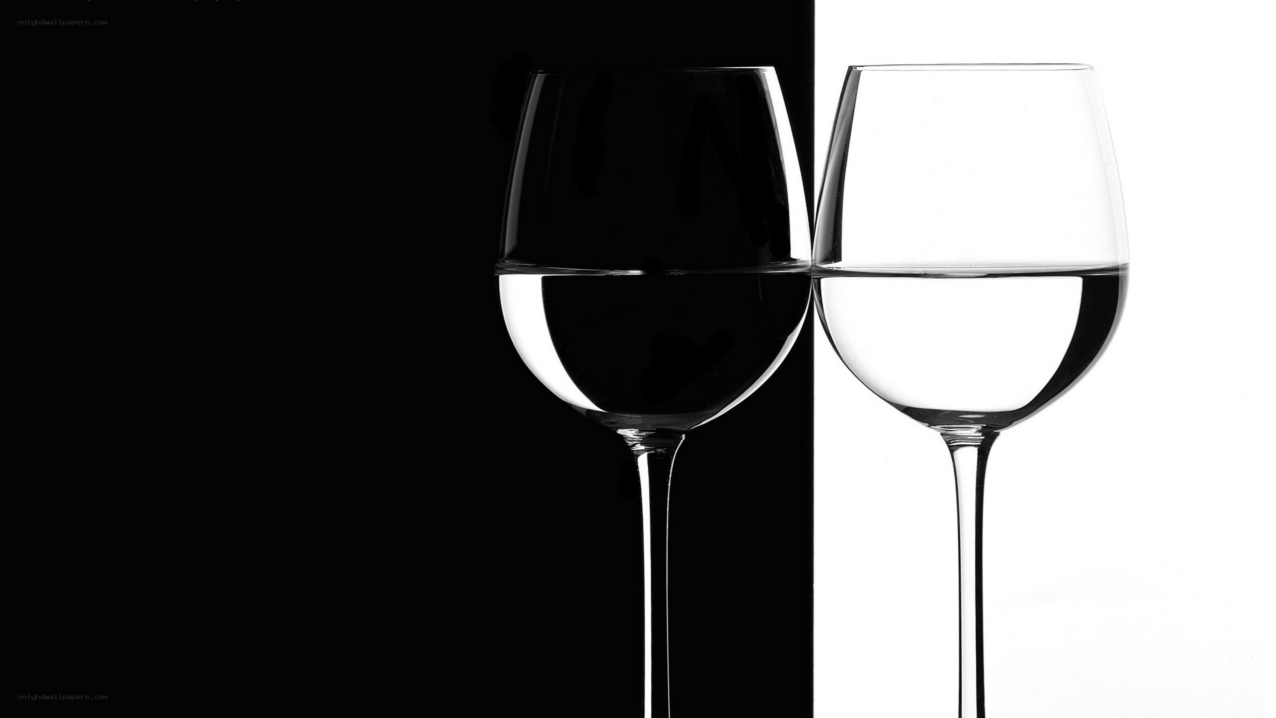 Two wine glasses in contrast