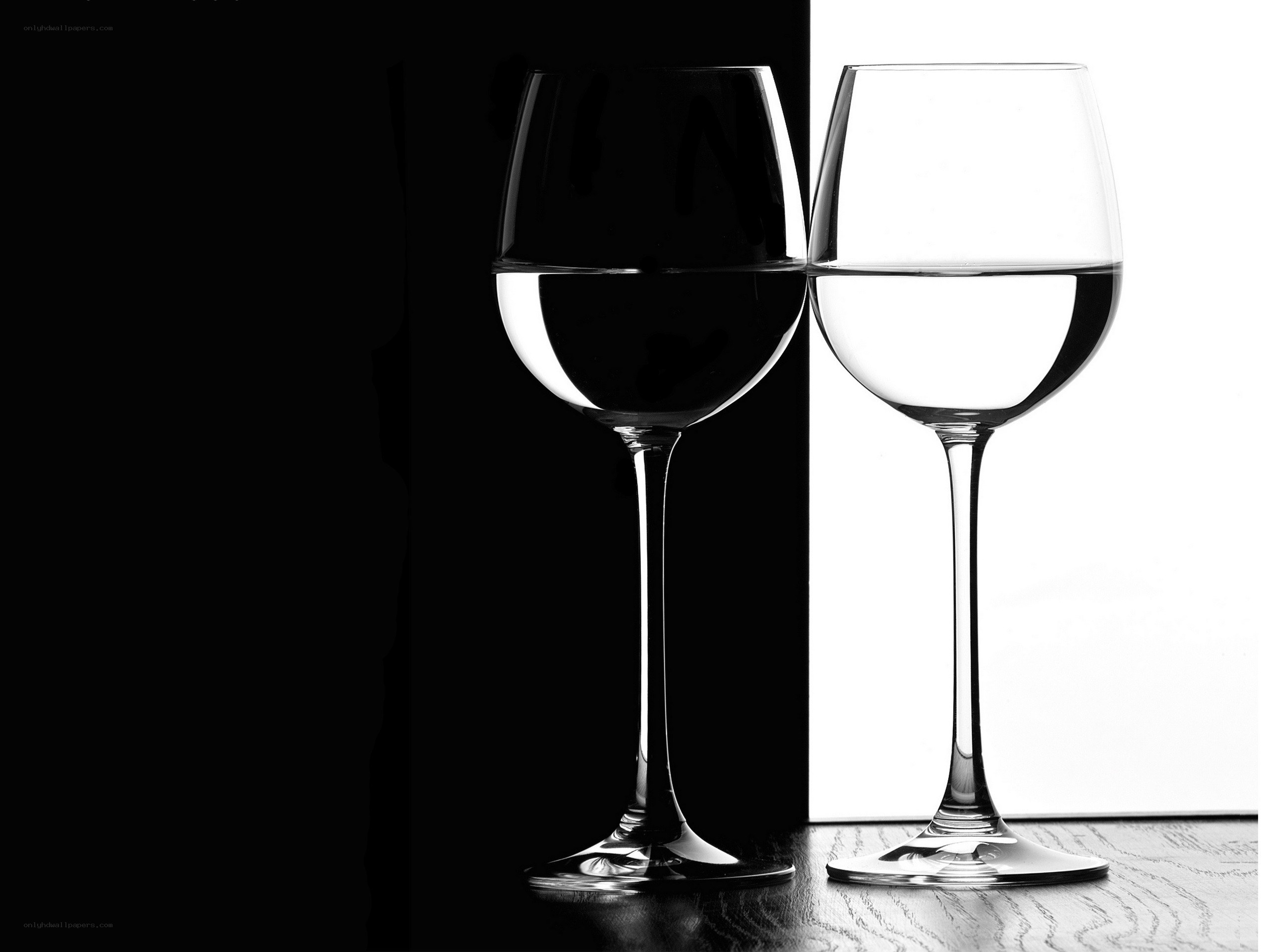 Two wine glasses in contrast