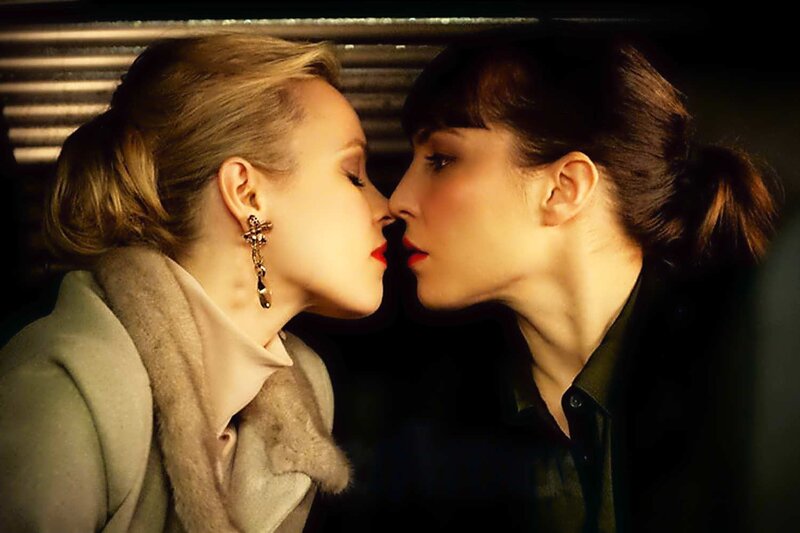 two women about to kiss