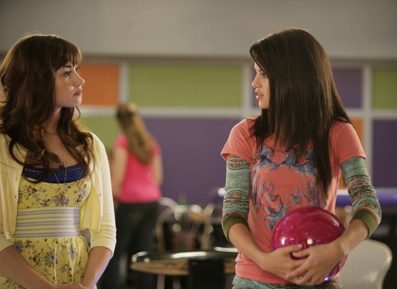 Two women at a bowling alley