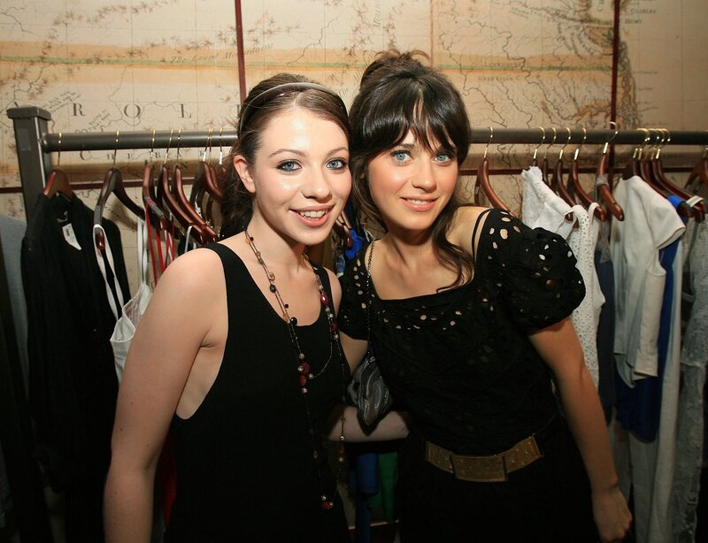 Two women at a clothing event