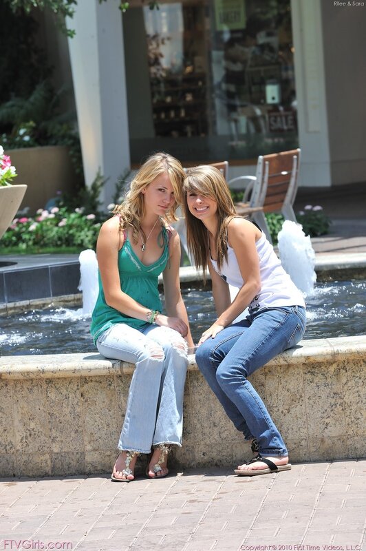Two women at a fountain