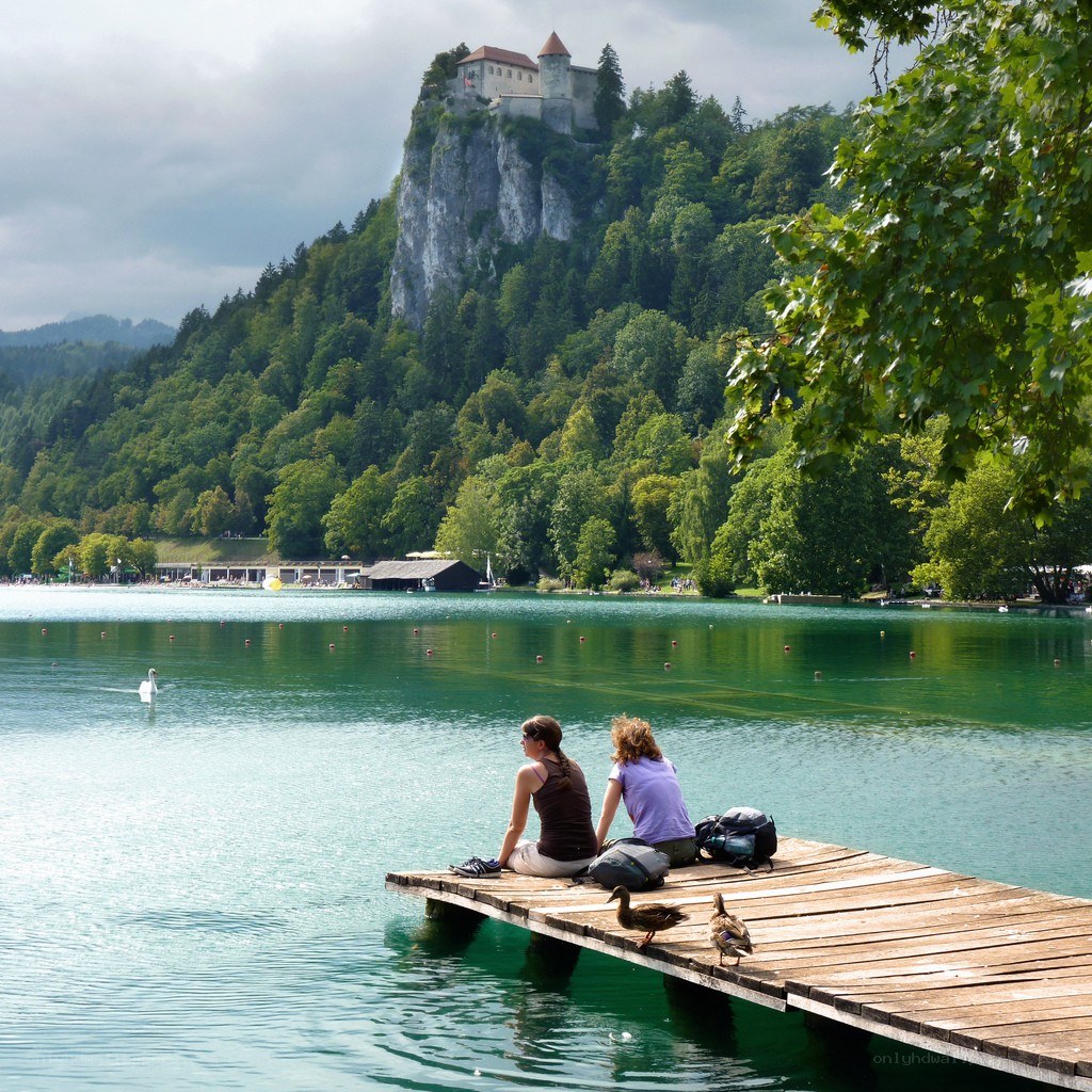 Two women at a lakeside dock
