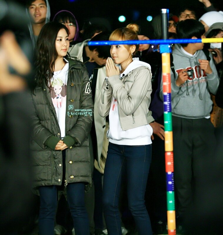 Two women at a nighttime event