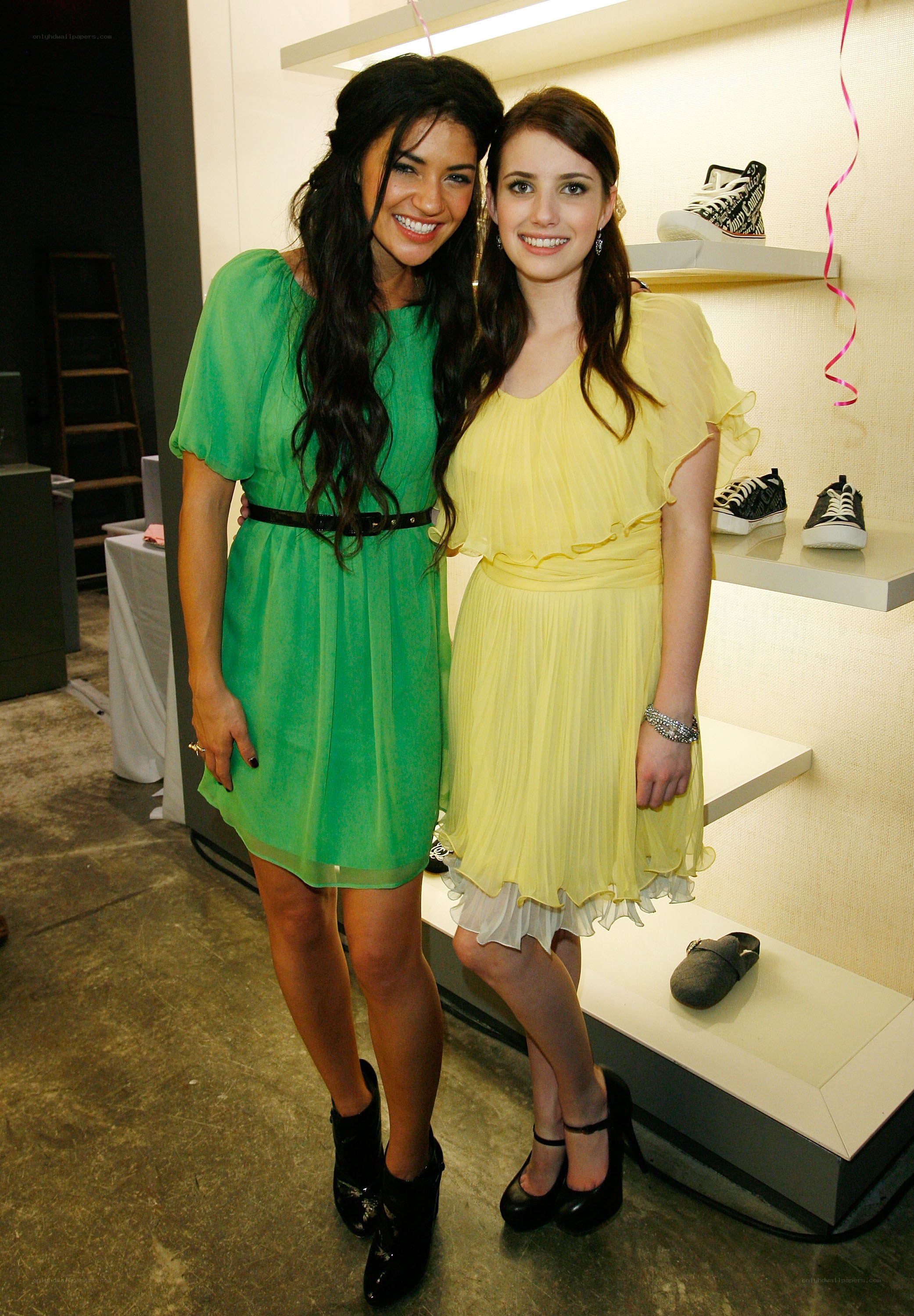 Two women at a shoe store event