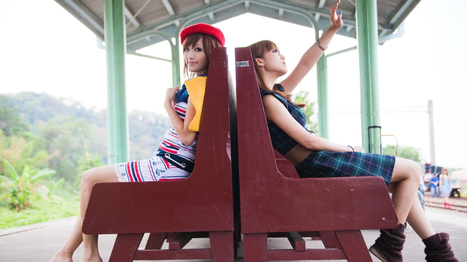 Two women at a train station