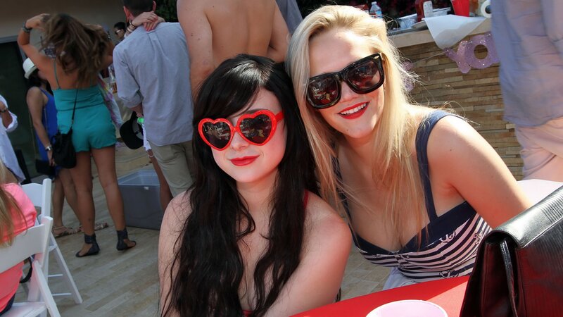 Two Women at Outdoor Event — Red