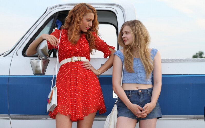 Two women by a pickup truck