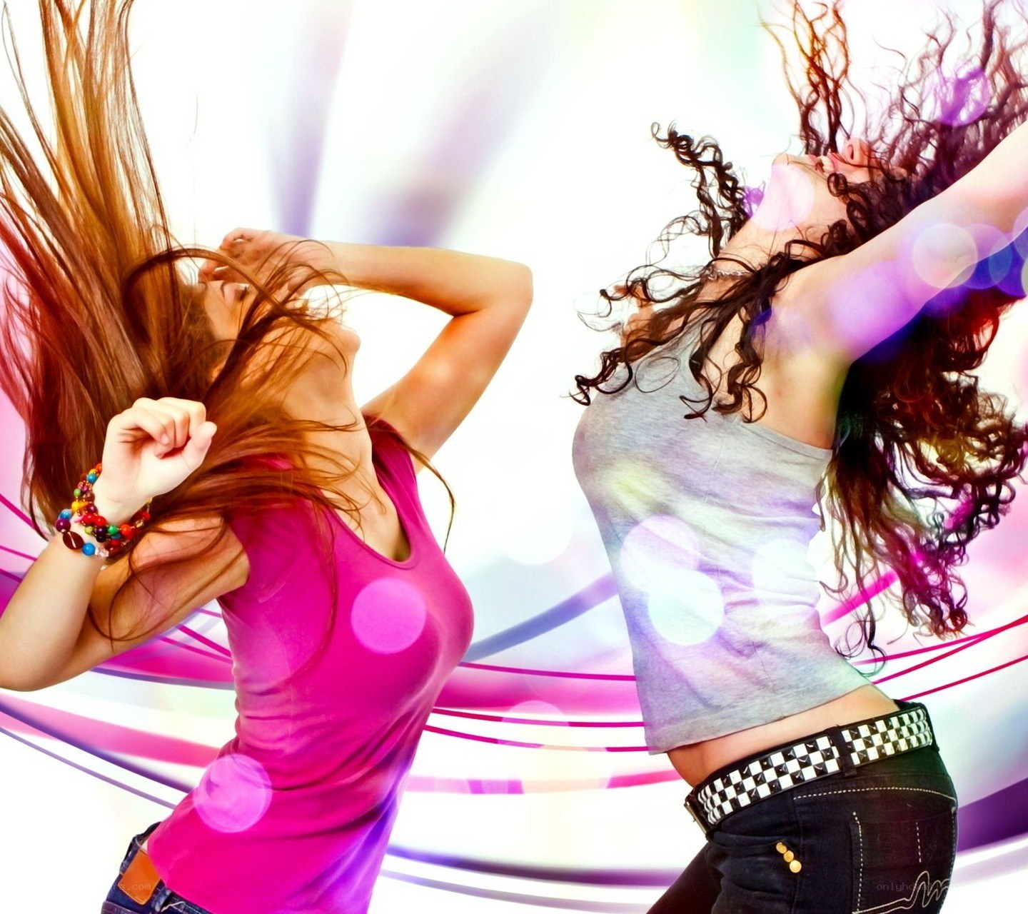 two women dancing at a party