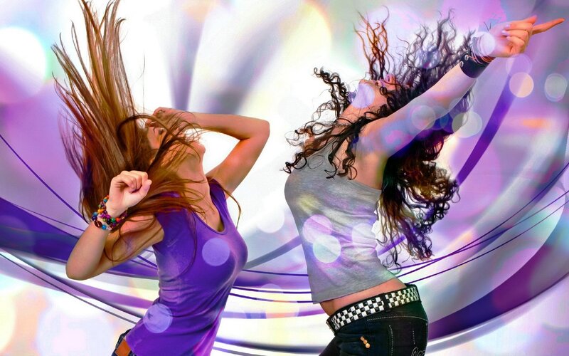 two women dancing energetically
