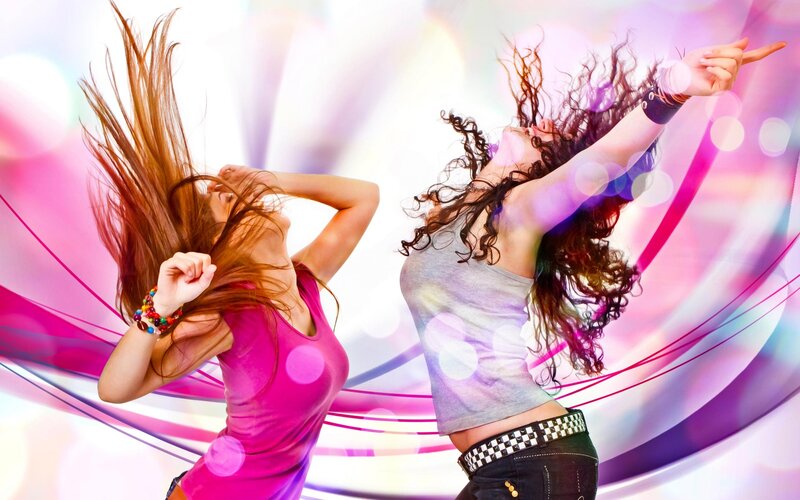 two women dancing energetically