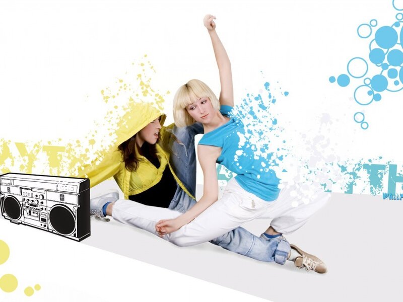 Two women dancing with boombox