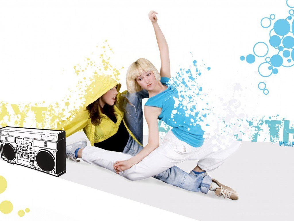 Two women dancing with boombox