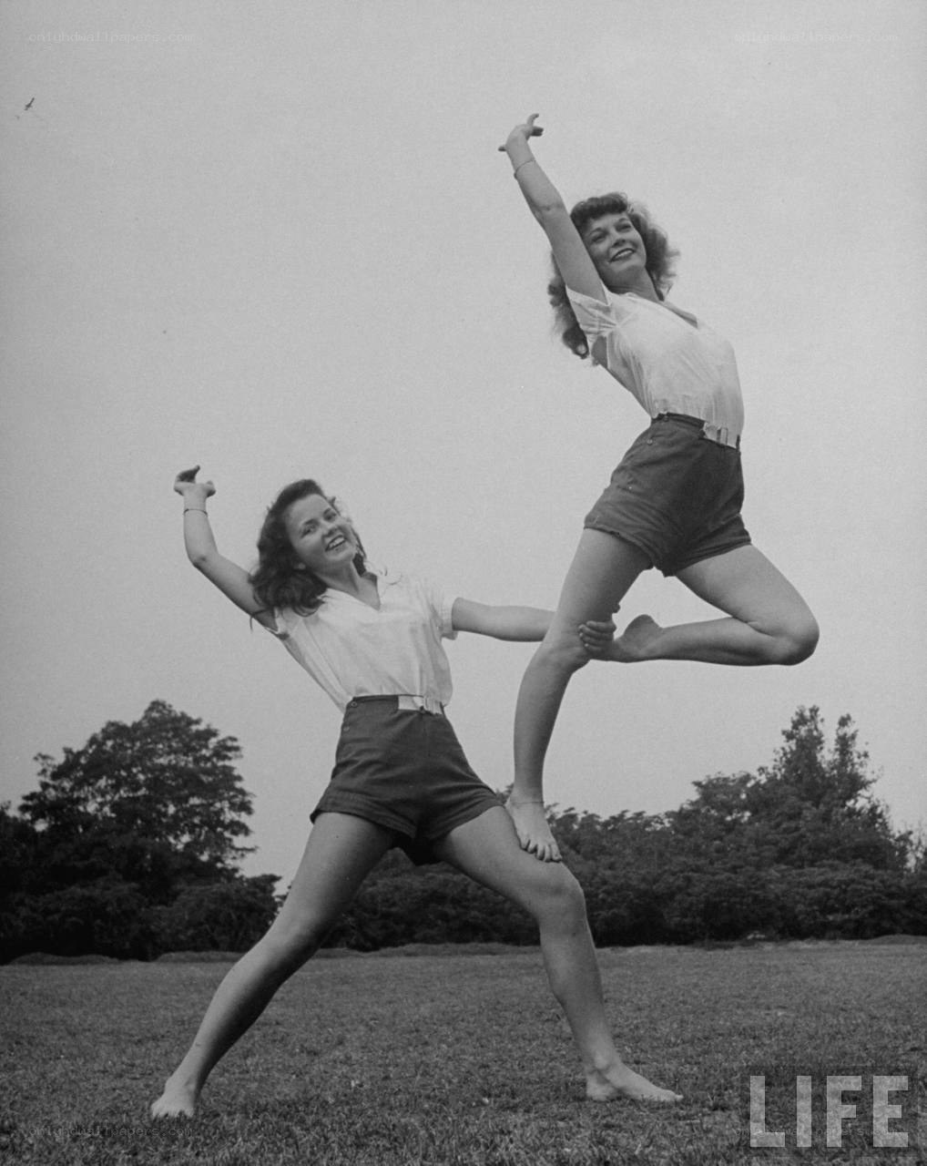 Two women doing acrobatics