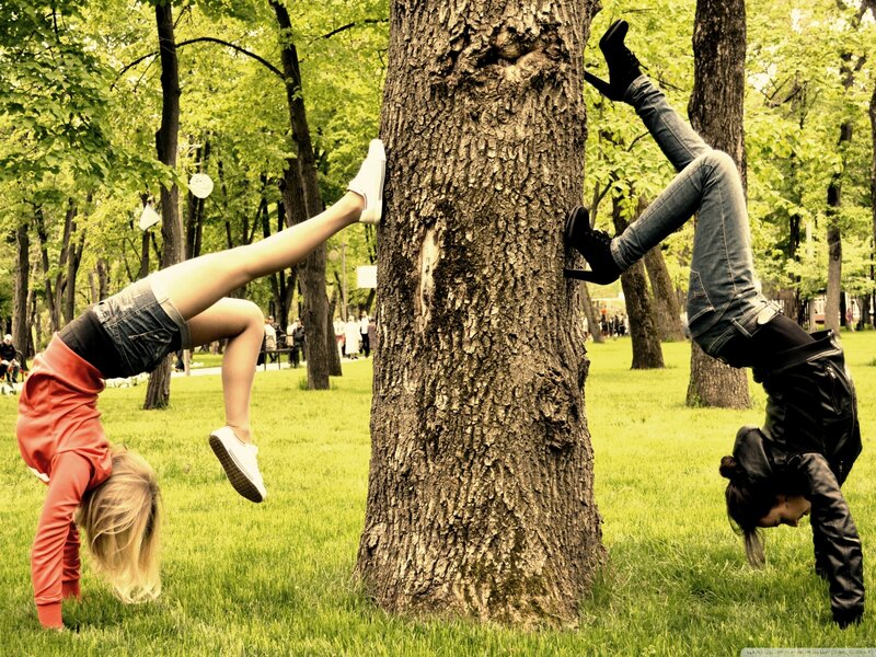 Two Women Doing Handstands