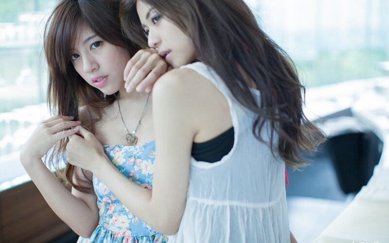 Two Women Embracing — Blue, Intimate, Afternoon, Photograph, Necklace
