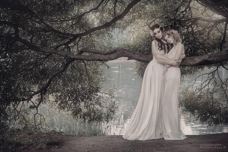 Two Women Embracing — White