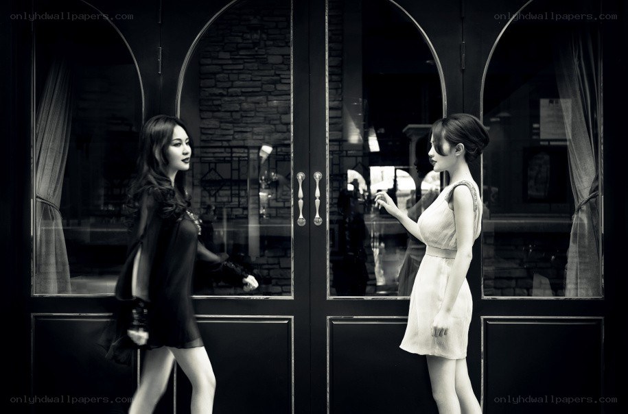 Two women facing each other