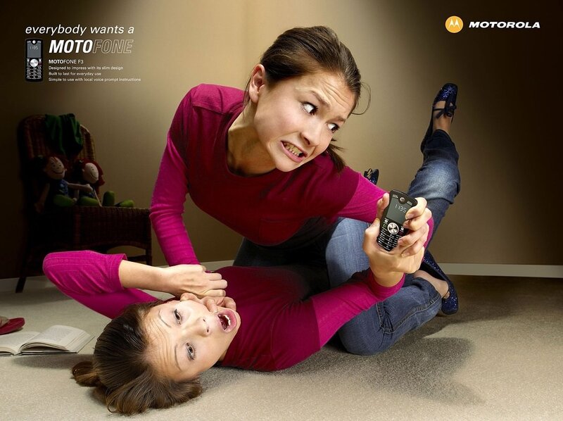 Two women fighting over a phone