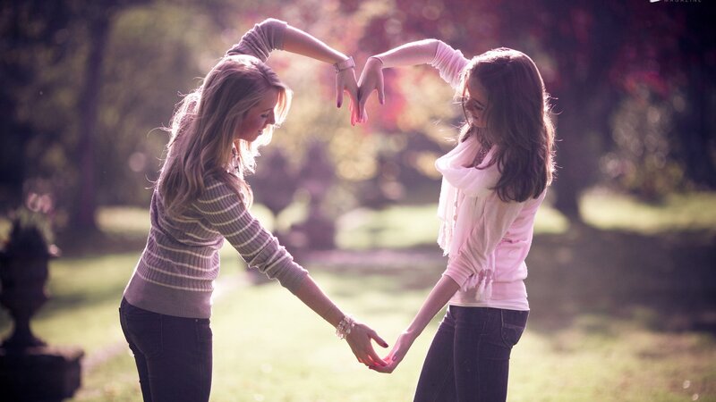 Two Women Forming Heart Shape — Pink