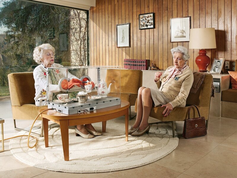 Two women having tea in a living room