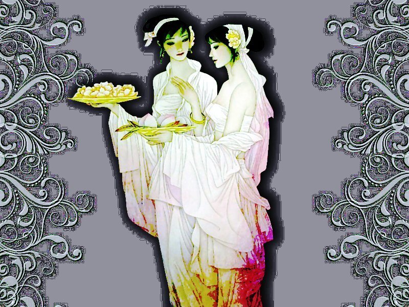 Two women holding a tray