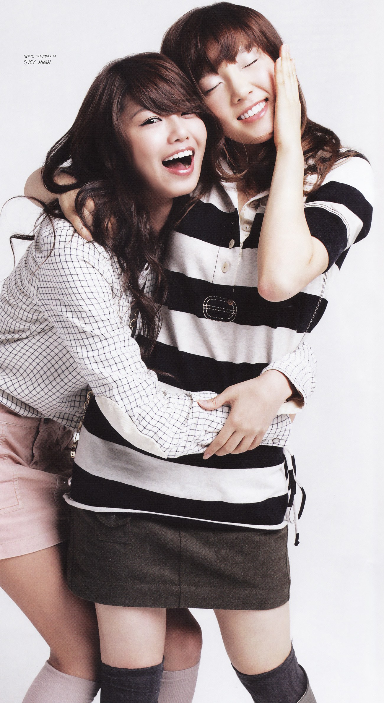 two women hugging and smiling