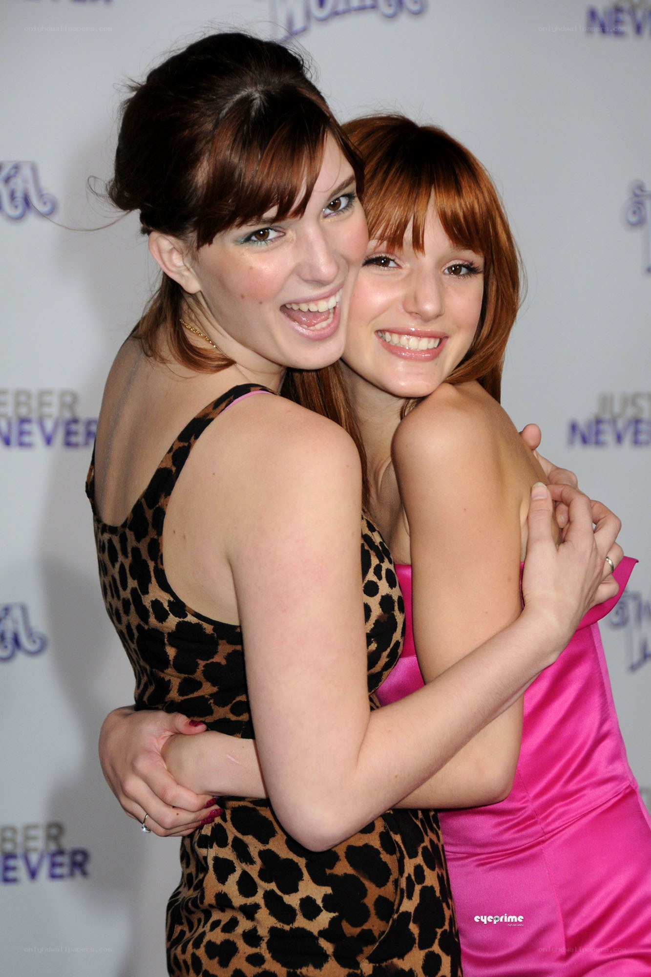 Two women hugging at event