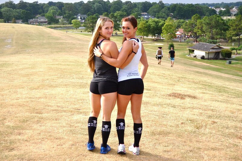 Two women hugging in a park