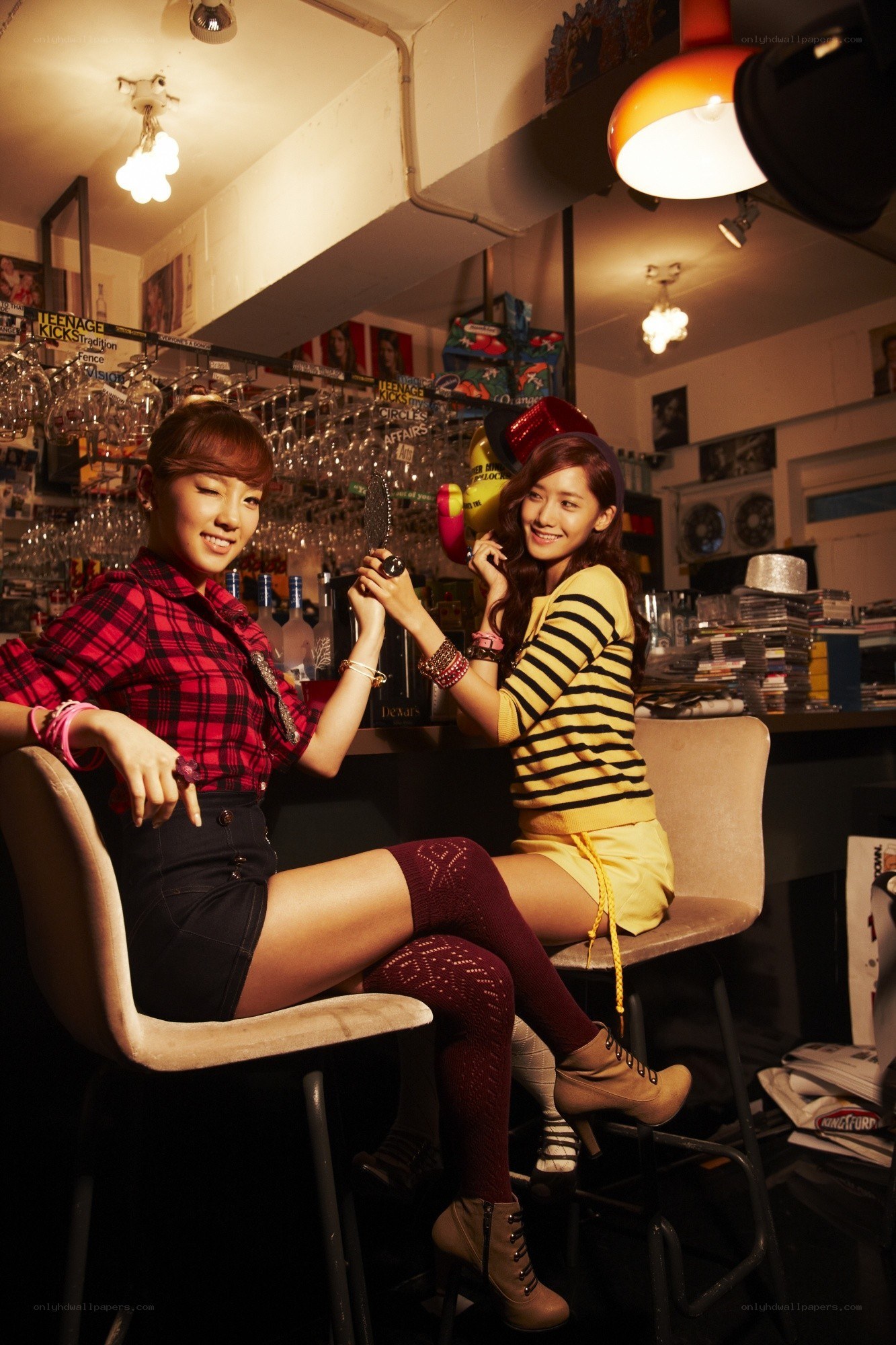 Two women in a bar setting