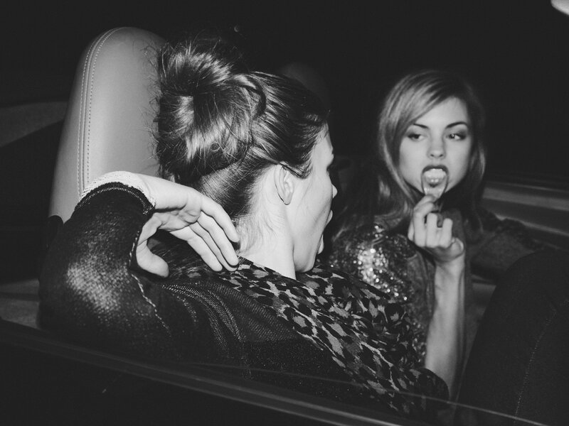 Two women in a car at night