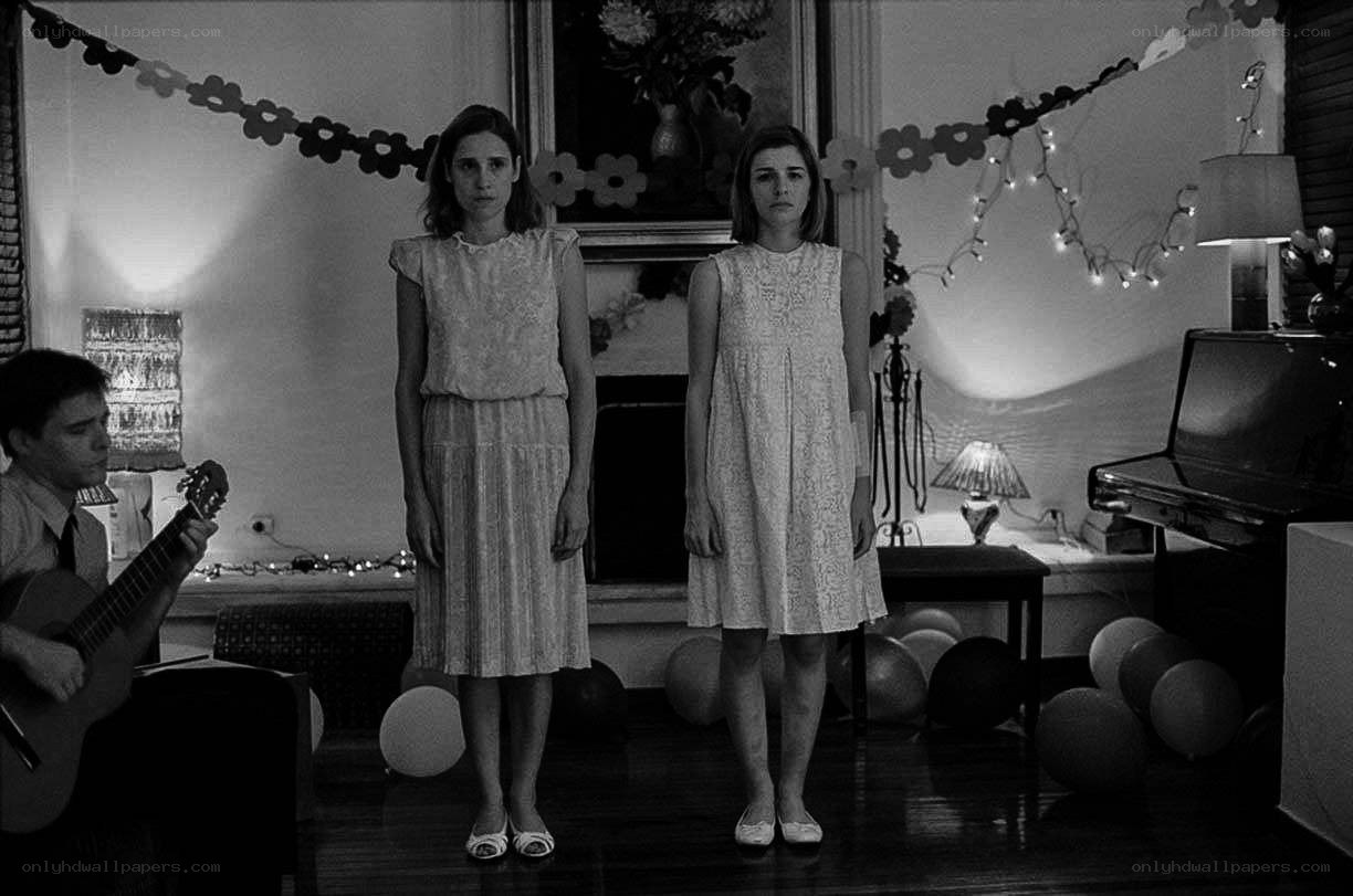 Two women in a decorated room