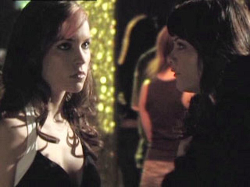 two women in a dimly lit room