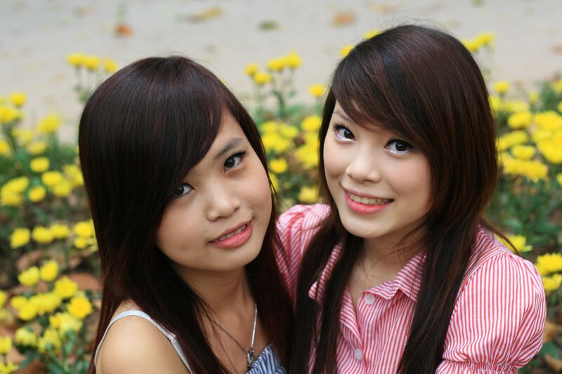 two women in a flower garden