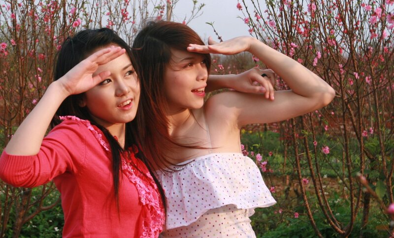 Two women in a flower garden