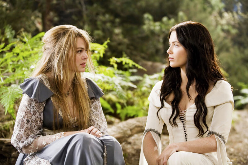 Two women in a forest conversation