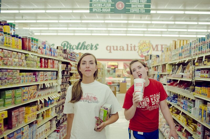 Two women in a grocery store aisle