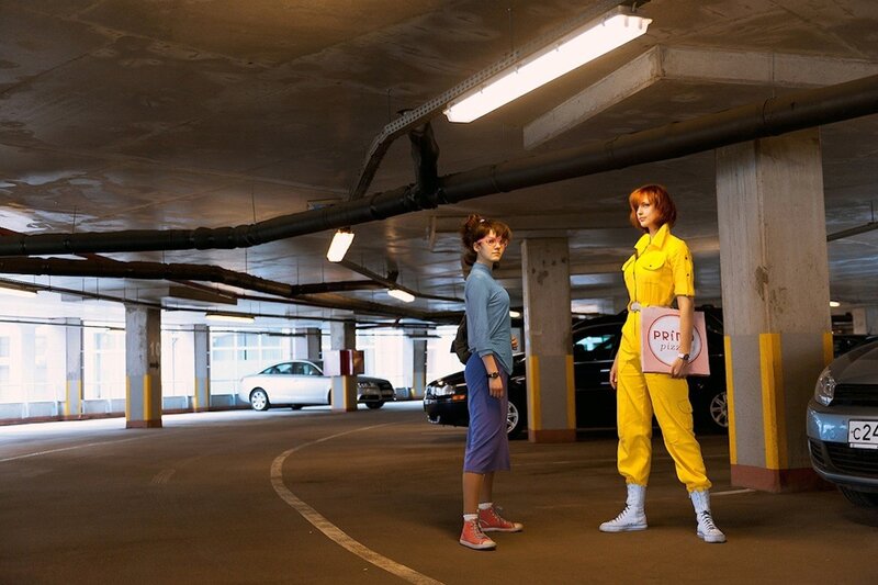 Two women in a parking garage