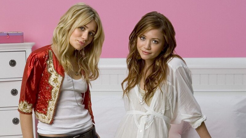 two women in a pink room