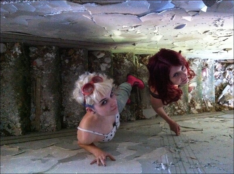Two women in a ruined room