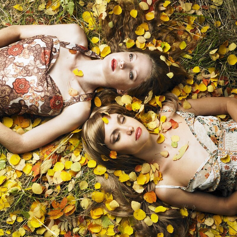 Two Women in Autumn Leaves