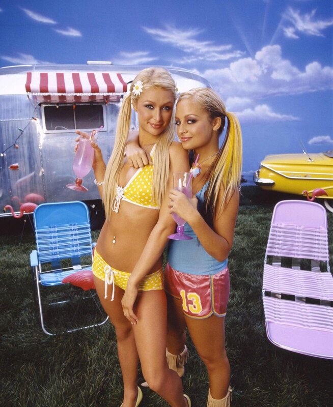 Two women in beachwear with drinks