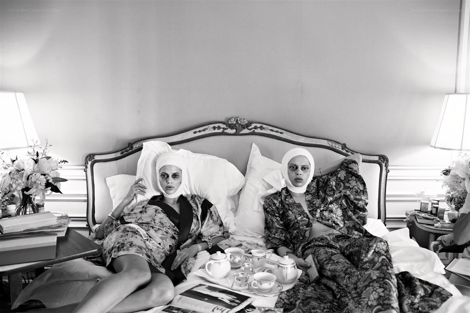 Two women in bed with tea