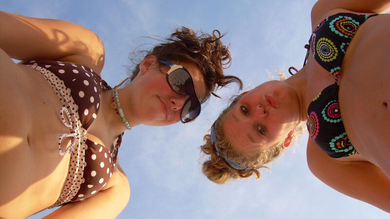 two women in bikinis outdoors