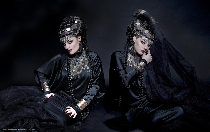 Two women in black costumes