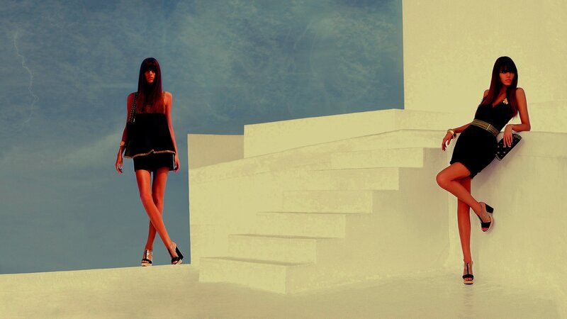 Two women in black dresses
