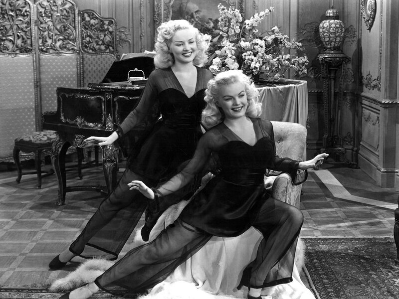 Two Women in Black Dresses — Elegant