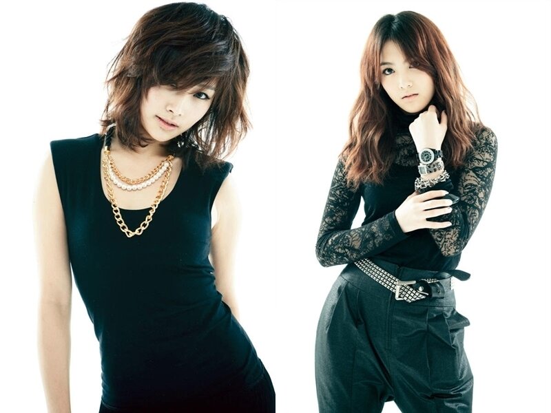 two women in black outfits